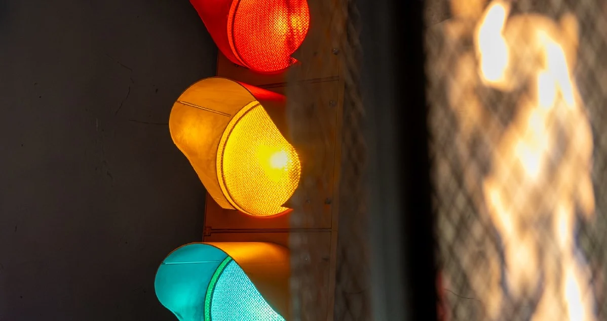 Traffic-light lamp beside a fire