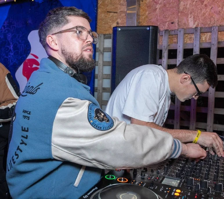 Two DJs at the mixing desk