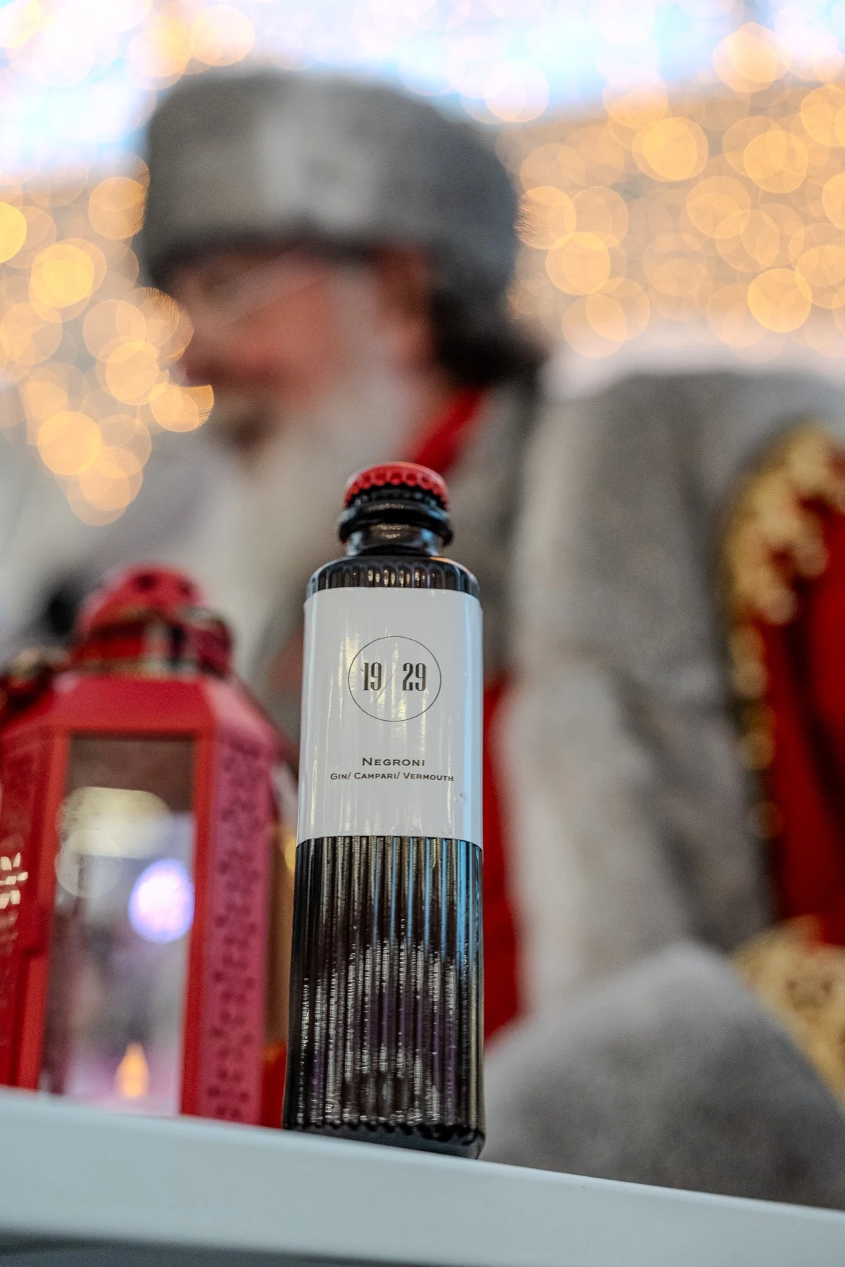 A 19/29 bottle beside a red lantern, Father Christmas behind