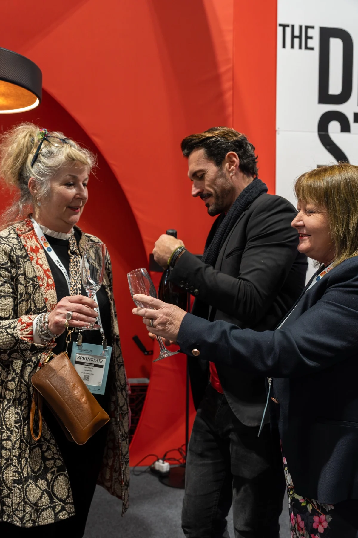 Guests with drinks in front of the Design Studio