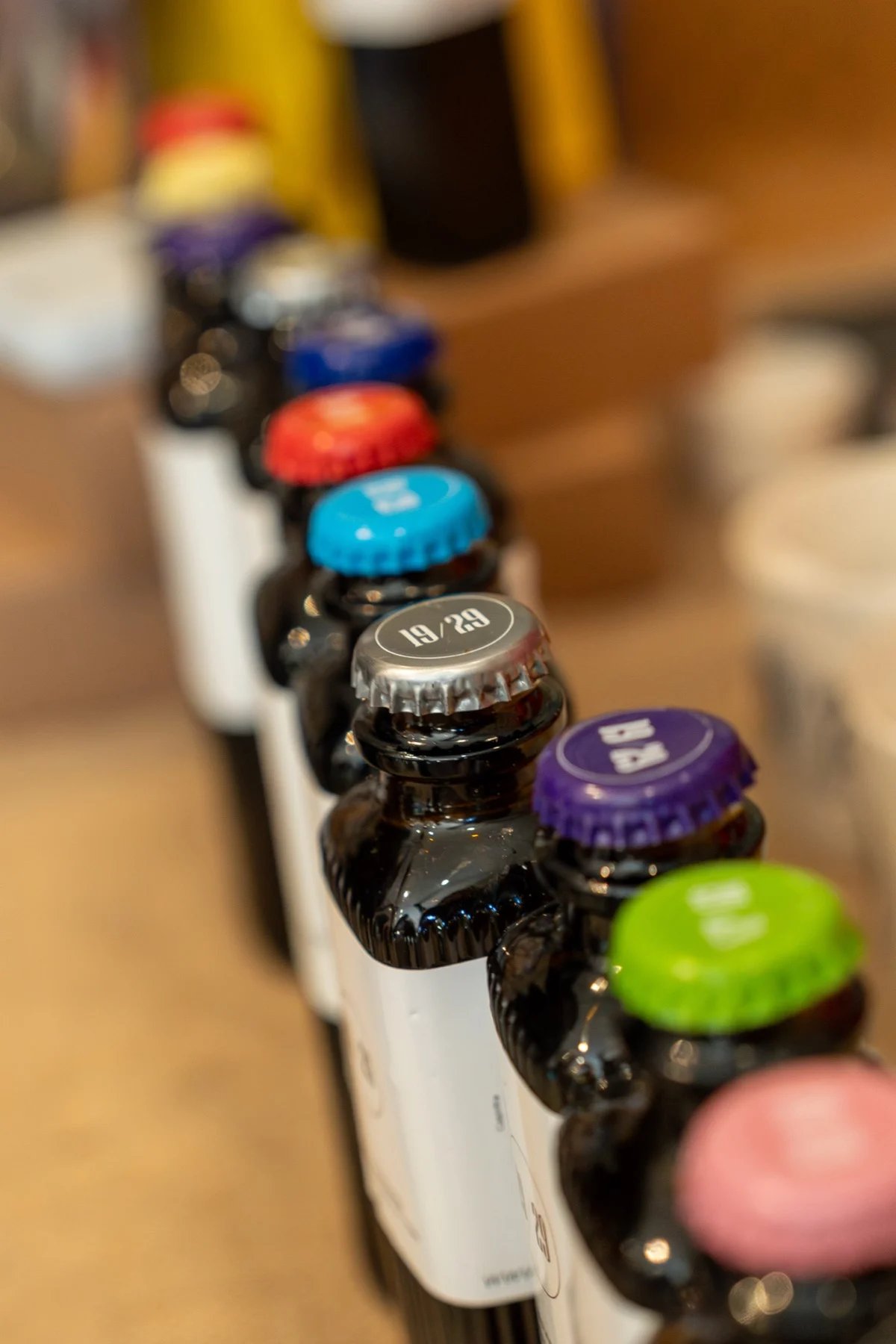 19/29 bottles with coloured crown caps