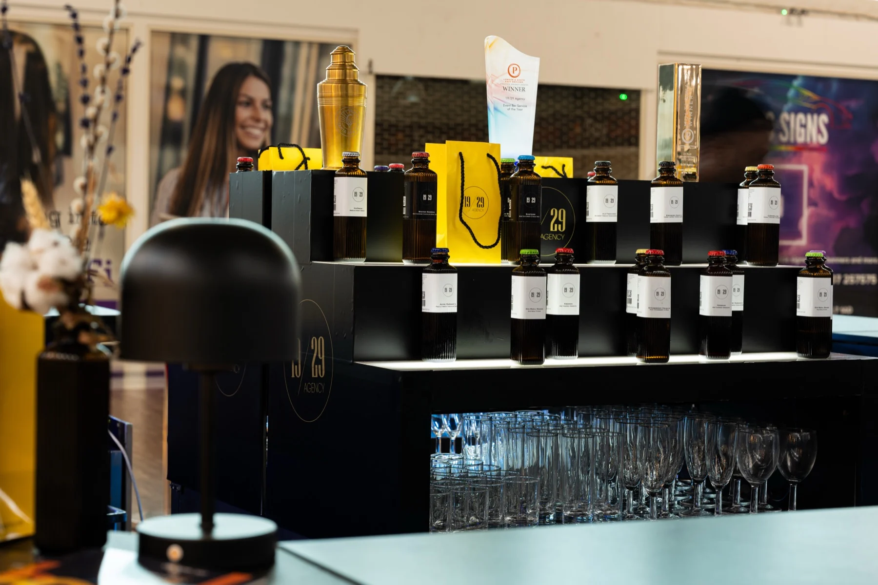 The 19/29 back bar with bottles, gift bag and glassware