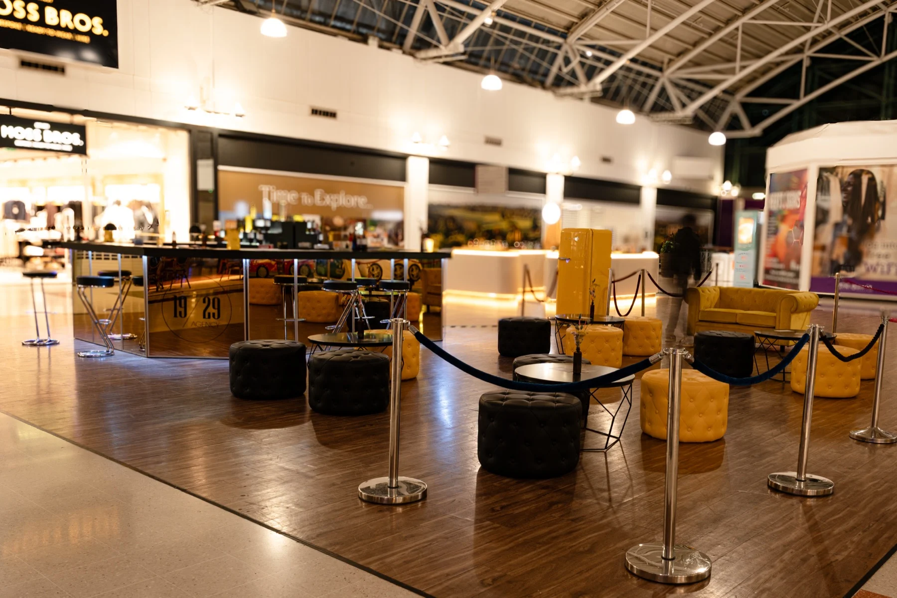 The pop-up seating area behind velvet rope barriers