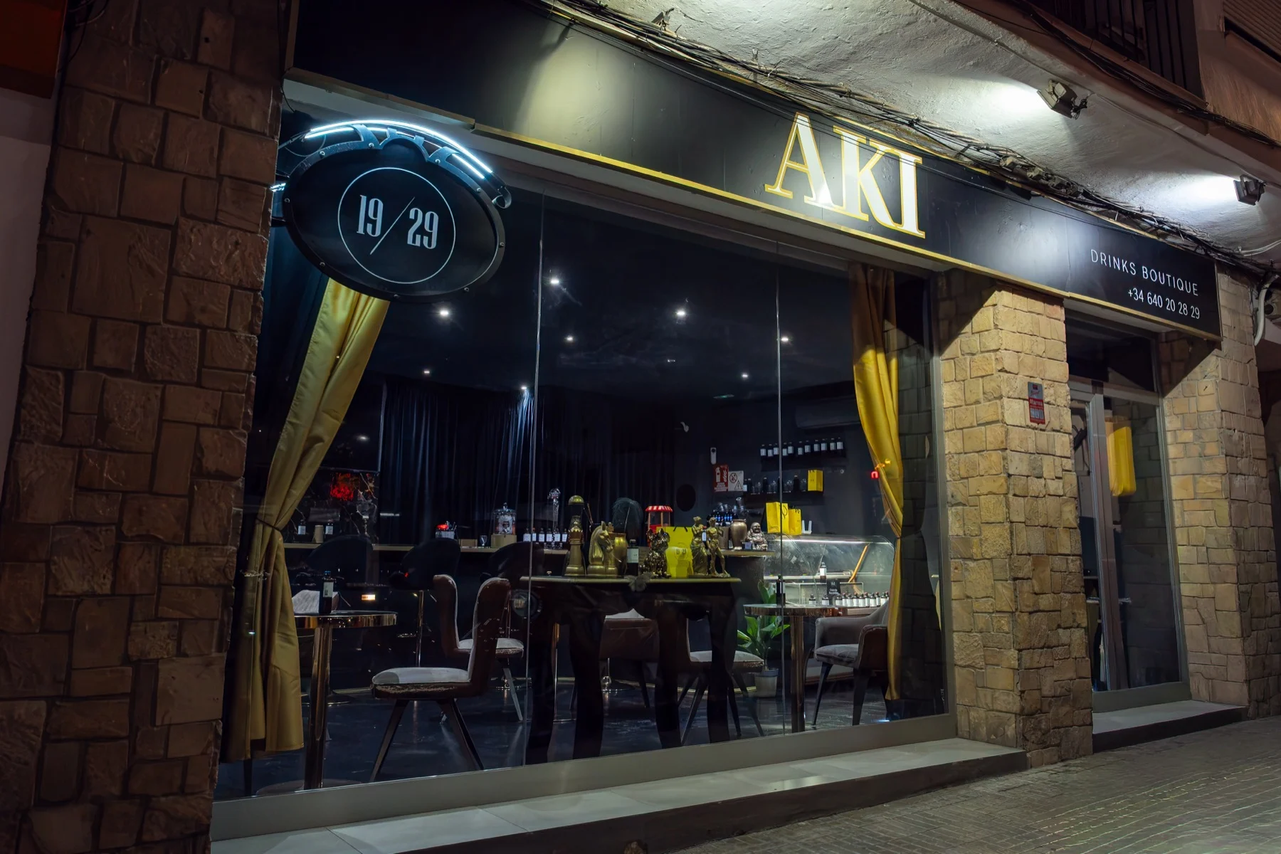 The AKI drinks boutique on Via Romana, Ibiza, at night